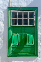 Rustic green wooden window on white background