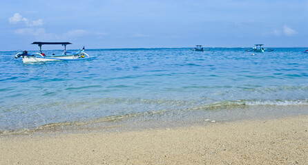 traditional wooden fishing boat on Kuta beach, Bali. Indonesia