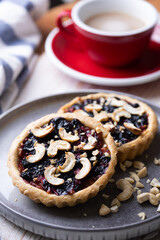 tartlets with apple jam and blueberry confiture