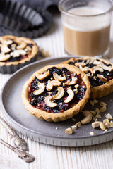 tartlets with apple jam and blueberry confiture