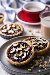 tartlets with apple jam and blueberry confiture