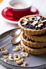 tartlets with apple jam and blueberry confiture