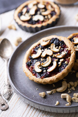 tartlets with apple jam and blueberry confiture