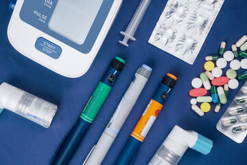 Picture of medical drugs pills, sryinge, insulin pen, automatic blood presure monitor device and...