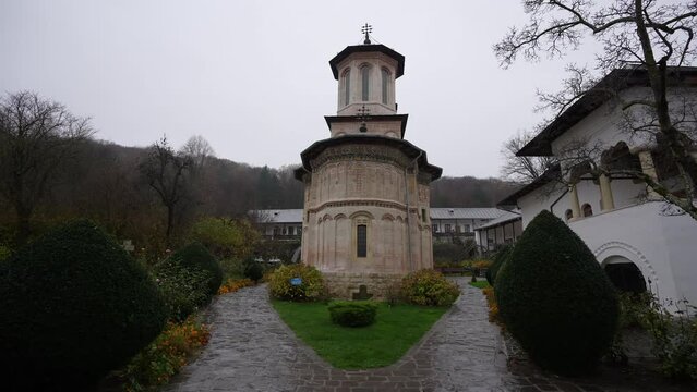Wide angle 4K video with this church from Valcea county. One wood church monastery (Biserica dintr-un lemn in Romanian language) landmark from Romania, 2022.