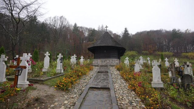 Wide angle 4K video with this church from Valcea county. One wood church monastery (Biserica dintr-un lemn in Romanian language) landmark from Romania, 2022.