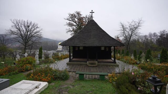 Wide angle 4K video with this church from Valcea county. One wood church monastery (Biserica dintr-un lemn in Romanian language) landmark from Romania, 2022.
