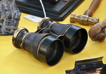 Old historical binoculars as a decoration on a table