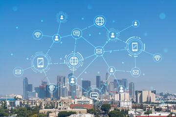 Los Angeles panorama skyline of downtown at day time, California, USA. Skyscrapers of LA city. Glowing Social media icons. The concept of networking and establishing new connections between people