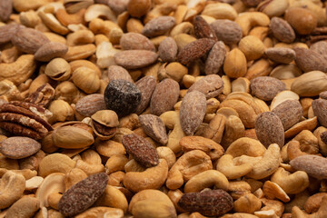 A group of almonds, pistachios, walnuts, macadamia, cashews.