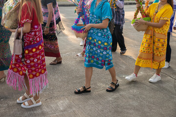 Fototapeta na wymiar group of tribal women are walking to charity.