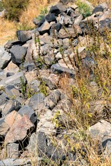 Large stones of mountain scree on the slope as a natural background.