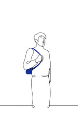 man stands holding the handle of a briefcase hanging on his back - one line drawing vector. concept man with backpack