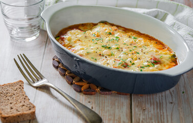 Zucchini and cheese gratin in a baking tray. Crunchy and healthy.