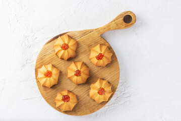Fresh butter cookies for Chinese New Year on wooden board. Shortbread kurabye.