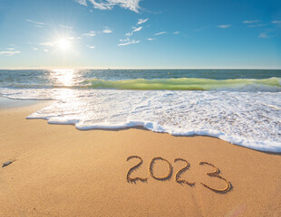 2023 year on the sea shore at day. - 547905920