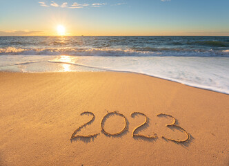 2023 year on the sea shore during the sunset.