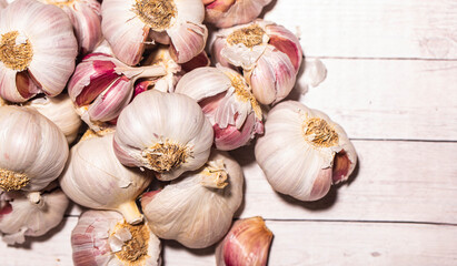 white garlic on wooden table