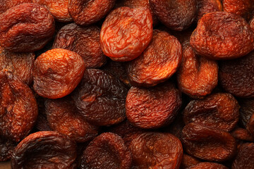 Tasty dried apricots as background, top view. Healthy snack