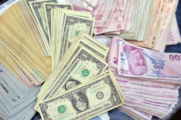  Turkish Lira and American Dollars. Financial crisis, devaluation and exchange rates themed banknotes close-up