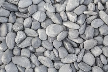 Foto op Aluminium small smooth waterworn black pebbles or stones for use decor and garden landscaping. tone garden interiors. stone spa © pattanawit
