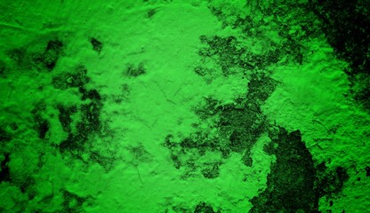 A textured green grunge background with dark patches and rough surface