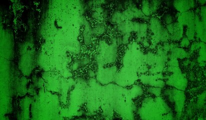 A textured green grunge background with dark patches and rough surface