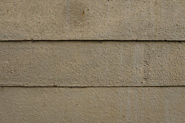 Grey rusty concrete planks from a wall. Perfect for a texture or pattern in the context of a grungy or urban design.