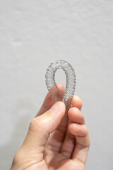 person holding a flexible vascular stent
