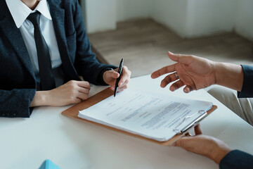 Guarantee, mortgage, agreement, contract, sign, the customer is signing the contract document as...