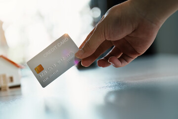 Portrait of young Asian woman holding credit card  for online shopping