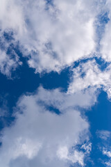 Dramatic blue sky with white clouds.