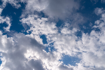 Dramatic blue sky with white clouds.