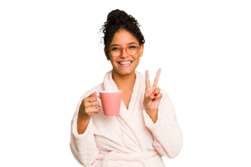 Young brazilian woman wearing a pajama holding a cup isolated showing number two with fingers.
