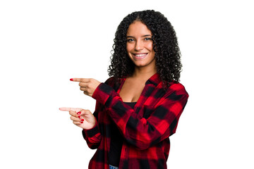Young cute brazilian woman isolated excited pointing with forefingers away.