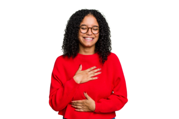 Young cute brazilian woman isolated laughs happily and has fun keeping hands on stomach.