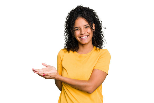 Young cute brazilian woman isolated holding a copy space on a palm.