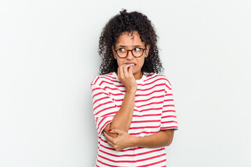 Young african american woman isolated biting fingernails, nervous and very anxious.