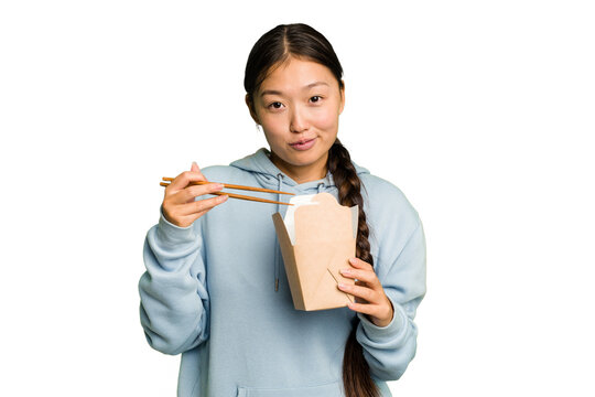 Young asian woman eating takeaway ramen isolated