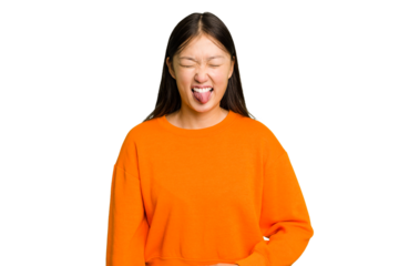 Young Asian woman isolated funny and friendly sticking out tongue.