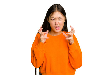 Young Asian woman isolated upset screaming with tense hands.