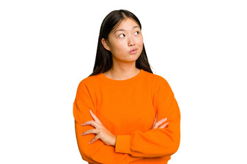 Young Asian woman isolated dreaming of achieving goals and purposes