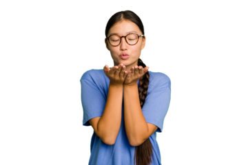 Young Asian woman isolated folding lips and holding palms to send air kiss.