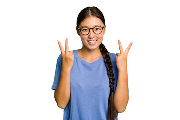 Young Asian woman isolated showing victory sign and smiling broadly.