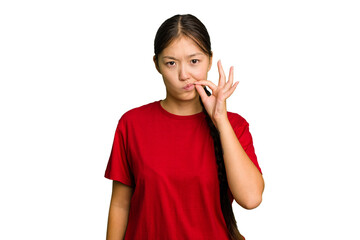 Young Asian woman isolated with fingers on lips keeping a secret.