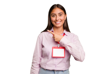 Young caucasian woman with a badge isolated smiling and pointing aside, showing something at blank space.
