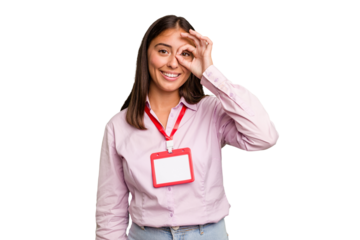 Young caucasian woman with a badge isolated excited keeping ok gesture on eye.