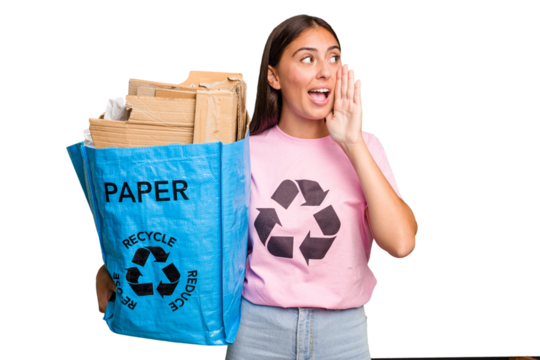 Young caucasian woman holding a recycling bag full of paper to recycle isolated shouting and holding palm near opened mouth.