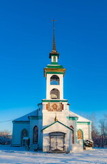 The building of the Orthodox church against the blue sky in winter. Russia. Ural. Polevskoy