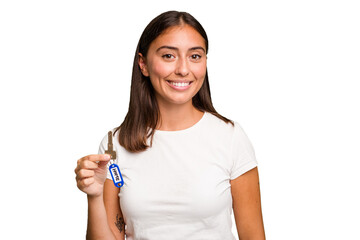 Young caucasian woman holding a home keys isolated happy, smiling and cheerful.